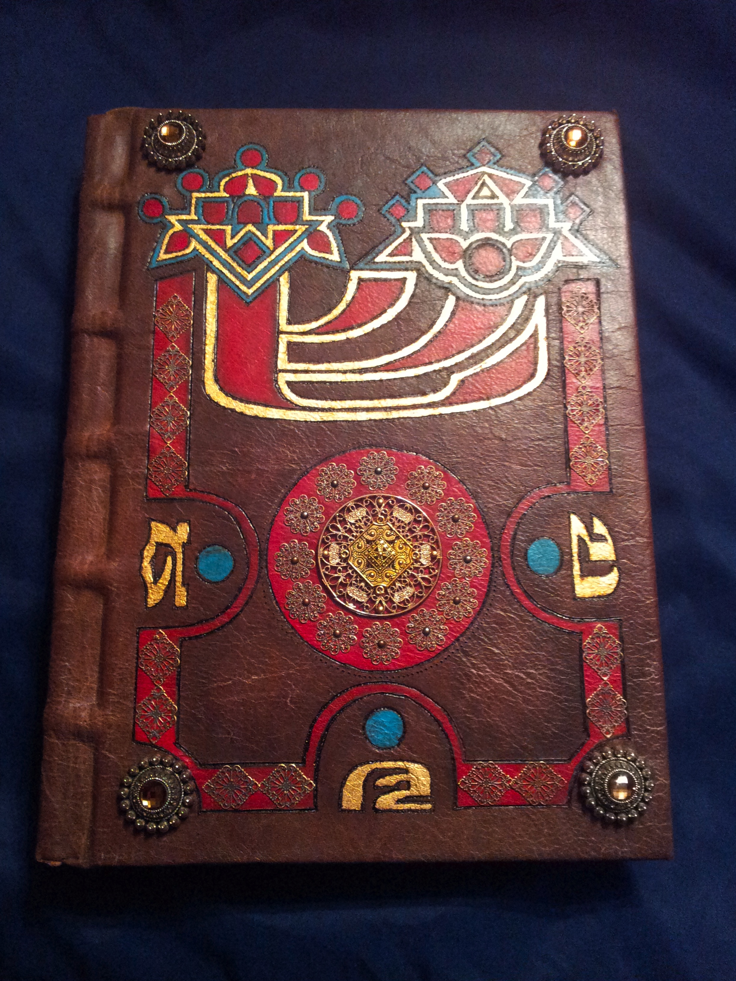 Ornately decorated leatherbound dictionary created for the Secret King project