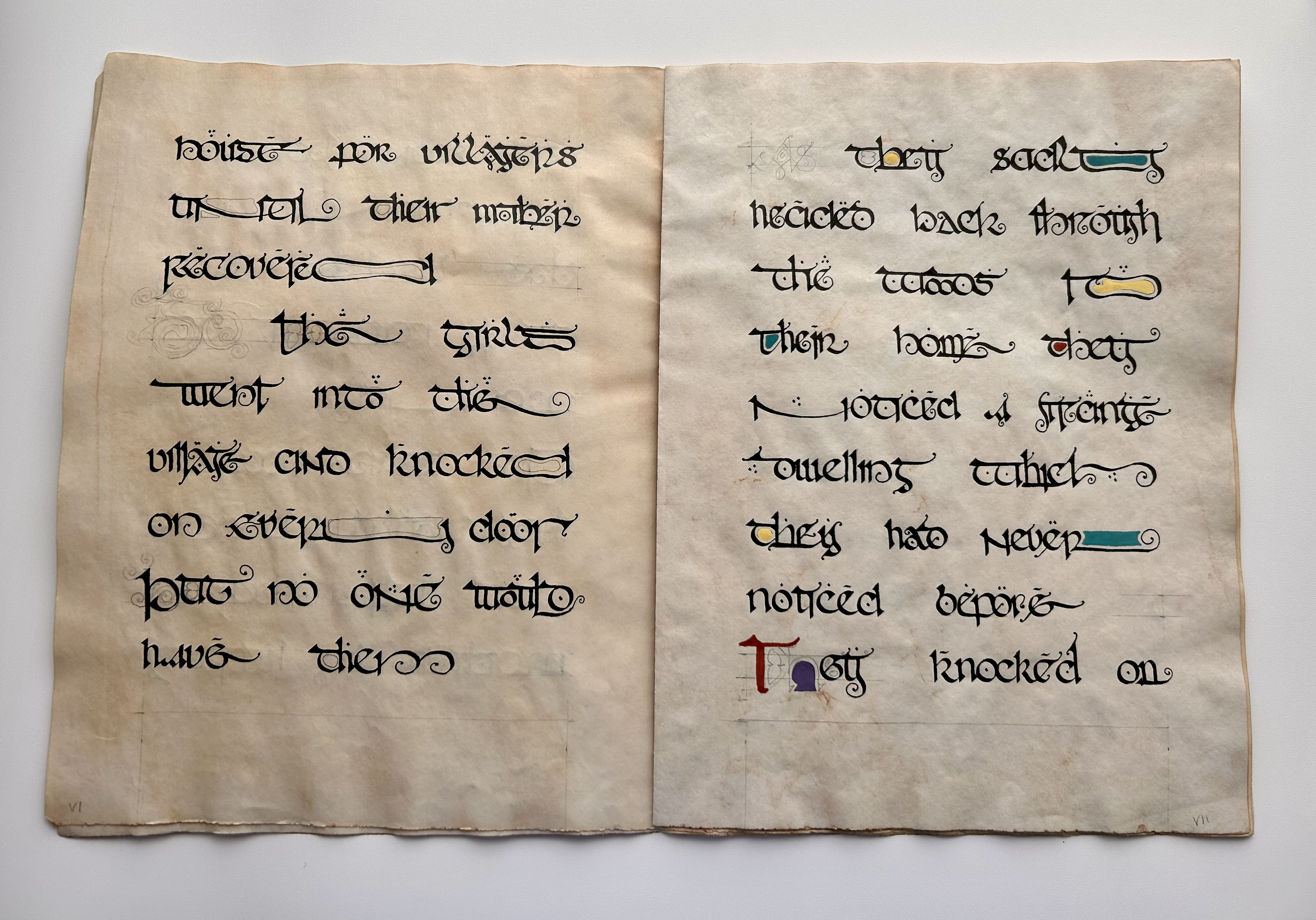 Calligraphic manuscript pages with decorative strokes and colored details